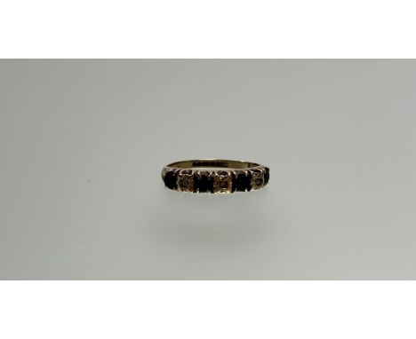 A 9ct gold half eternity style ring set four round cut sapphiresapproximately 0.1ct  and three round cut diamonds each stone 