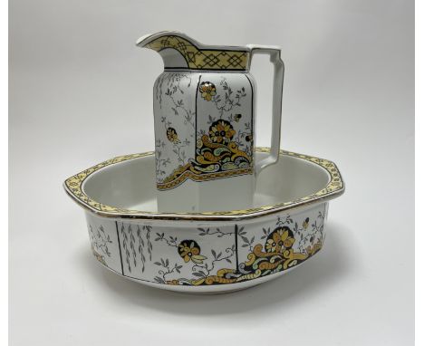 A Burleigh Ware wash jug and basin, the jug of slender form, decorated with foliate design (jug h.32 cm, basin d. 39cm) 