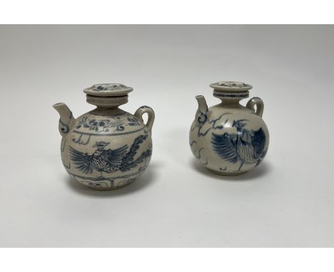 A Chinese blue and white pottery wine ewer of squat circular form decorated with exotic bird and foliate decoration to body, 