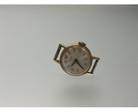 A 9ct gold Longines wristwatch with silvered dial and alternating baton and Arabic hour markers not working: d. x 1.5cm 8.6g 