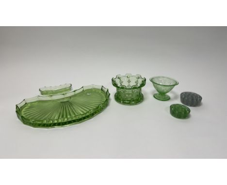 A collection of 1930s dressing table moulded uranium glass comprising, a large glass tray with sunburst pattern of half-oval 