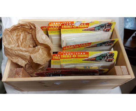 A wooden box containing a quantity of N-000 gauge Lone Star Treble O train items, most in unopened packaging including carria
