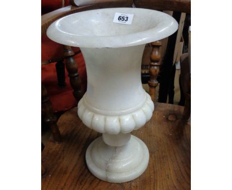 A vintage alabaster urn of tall goblet form