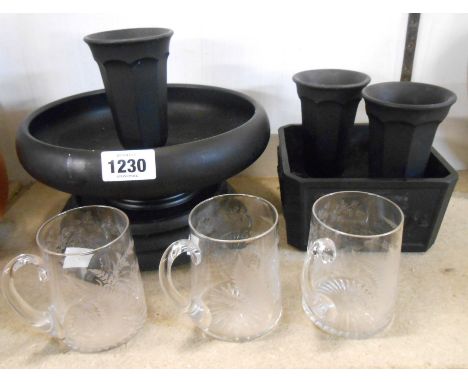 A quantity of early 20th Century black pressed glass items comprising Egyptian decorated planter, flower bowl with stand and 