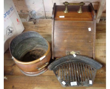 A late 19th Century lift-top coal box with brass fittings - sold with a copper coal scuttle of helmet form and a cast iron fi