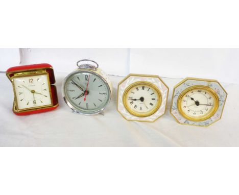 A vintage Diamond Brand alarm clock and three others