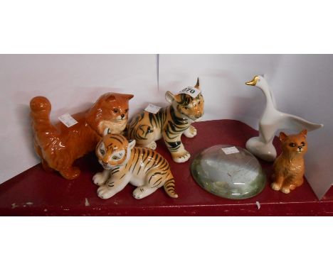 A small quantity of ceramic figurines comprising USSR tiger cubs, Beswick ginger cat, Royal Doulton kitten, and Hollohaza swa