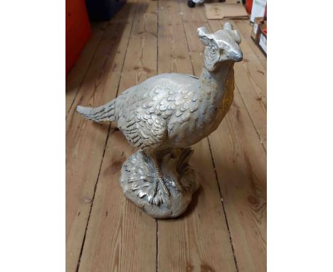 A large resin model, depicting a pheasant with silver painted finish