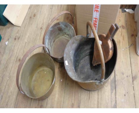 Two brass preserving pans with wrought iron handles - sold with a brass coal scuttle of helmet form and a pair wooden of bell