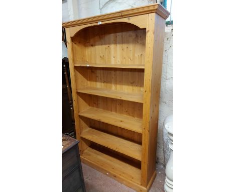 A 1.2m modern pine five shelf open bookcase