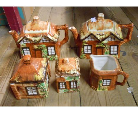 A box containing a Price Kensington Cottage Ware tea set comprising teapot, milk and sucrier - sold with another teapot and j