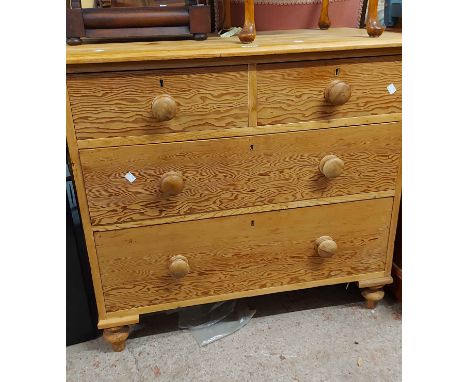 A 90cm vintage pine chest of two short and two long drawers, set on turned feet