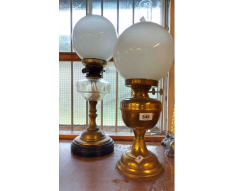 An old oil lamp with cut glass reservoir, brass column and ceramic base with an opaque glass shade of globe form - sold with 