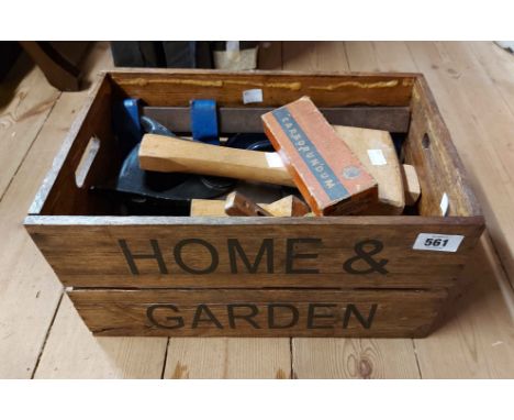 A wooden 'Home &amp; Garden' crate containing a quantity of carpentry tools including clamps, sharpening stone, etc.
