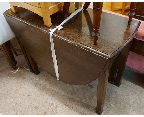 A 100cm vintage stained oak gateleg dining table, set on square tapered legs