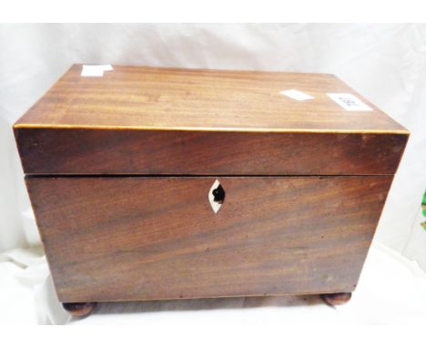 A 19th Century mahogany and strung tea caddy with double lidded compartments