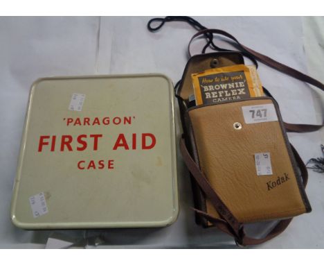 A vintage tin 'Paragon' First Aid case with red printed lettering and contents - sold with a vintage Kodak Brownie Reflex cam