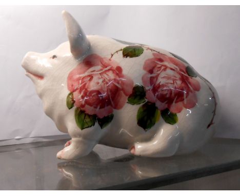 A Brian Adams Exon Wemyss style pig model with hand painted cabbage rose decoration