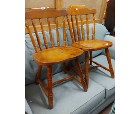 A set of six modern pine Windsor style stick back standard chairs