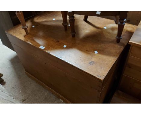 A 95cm vintage pine lift-top linen chest with flanking iron drop handles - wear to top