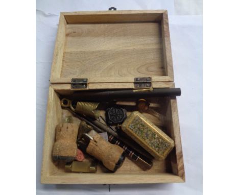 A wooden lift-top box containing a quantity of collectable items including papier-mache trinket box with floral and gilt deco