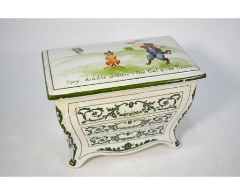 A Royal Doulton pottery biscuit box in the form of a three-drawer commode, the cover printed with 'Hey Diddle, Diddle, the Ca