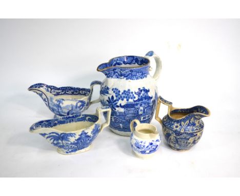 The Coysh Collection - Four 19th century blue transfer decorated jugs comprising:  Sauce boat decorated with the 'Woman Readi
