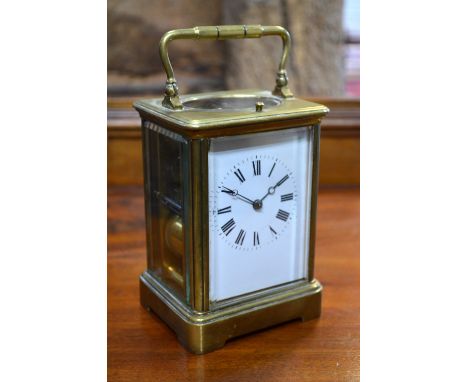 A French brass hour-repeating carriage clock, striking on a coiled gong, 18 cm high overall
