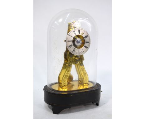 A late Victorian small brass skeleton clock with alarm movement striking on a bell, foliate-engraved frame, the silvered dial