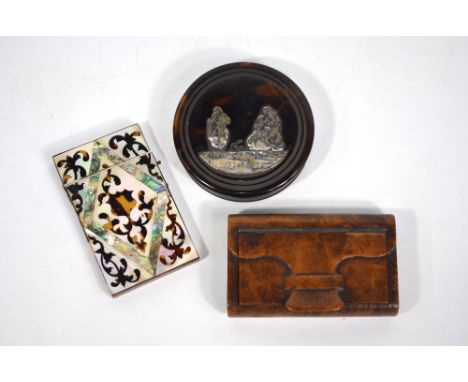 A 19th century carved wood snuff box in the form of a pocket-book, with tortoiseshell lining to/w a Continental circular tort