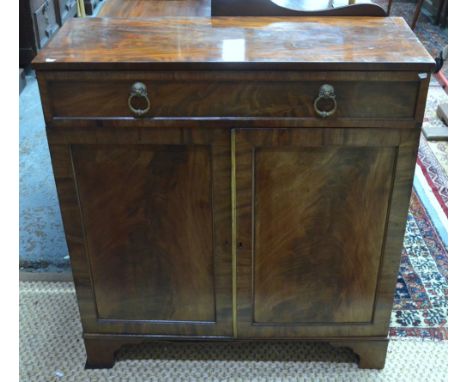 A Victorian mahogany cabinet with full width frieze drawer over a pair of panelled doors, raised on shaped bracket feet, 92 c