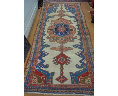 An old Persian Sarab runner, circa 1930's, the geometric lozenge design on camel ground, 3.30 x 1.30 m Condition Report dirty