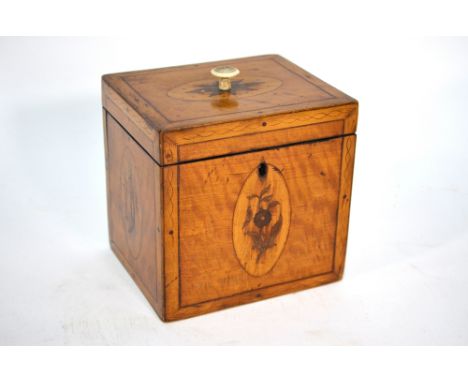 A Sheraton style inlaid satinwood cuboid tea caddy with floral and foliate medallions, 12 cm wide