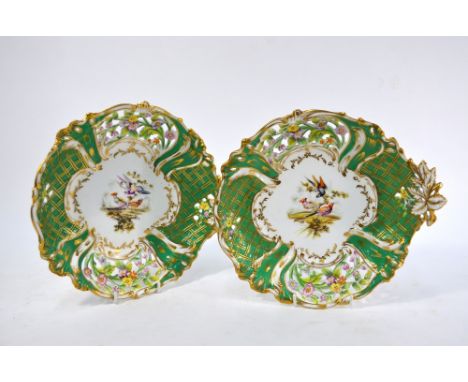 Two Victorian Staffordshire china cabinet plates painted with exotic birds with apple-green enamelled and gilt floral and fol