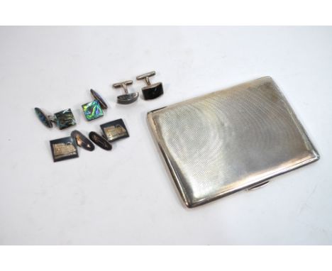 An engine-turned silver cigarette case, Smith & Bartlam, Jubilee marked Birmingham 1935, to/w three pairs of foreign low-grad