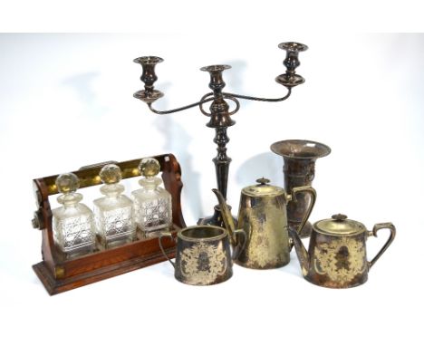 A 19th century Old Sheffield Plate large twin-branch candelabrum, a three-decanter tantalus, tapering vase and a tea pot, cof