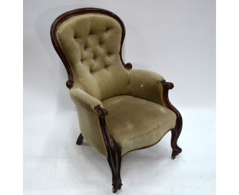 A Victorian mahogany framed button upholstered spoon back armchair