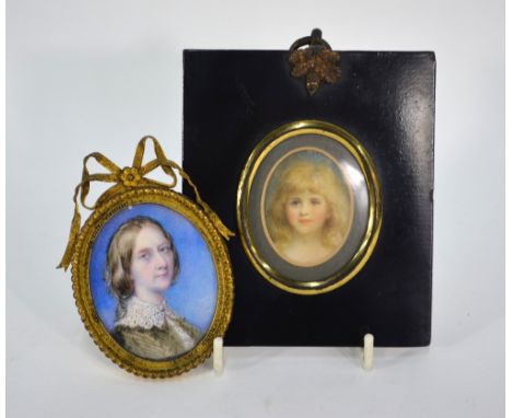 A Victorian oval portrait miniature on ivory of a lady, in ornate gilt metal frame, to/w another of a young girl, in ebonised