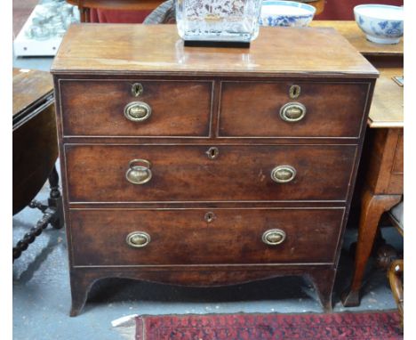 A George III mahogany chest of two short over two long graduated drawers, on splay bracket feet united by a shaped apron, 91 