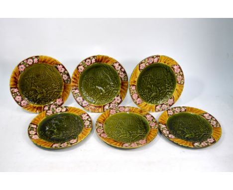 AMENDMENT - SIX (Not Seven) Sarreguemines majolica plates, embossed with a finch on blossoming twig with a house in the backg