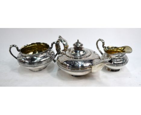 A William IV/Victorian silver matched three-piece bachelor tea service of compressed melon form, with reeded banding and flor