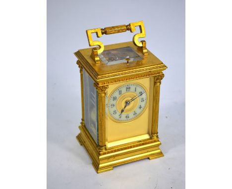 A French gilt brass quarter-repeating carriage clock, the two cylinder movement numbered 3620, striking with twin hammers on 