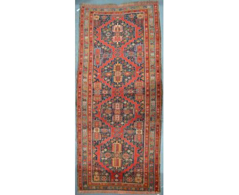 An antique Shirvan long rug, circa 1920's, 2.3 x 1.26 m Condition Report good even pile, outer guard border missing to both e