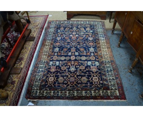Persian Mahal rug, rows of tendril linked rosettes on navy ground within repeating floral borders 188 x 126 cm Condition Repo