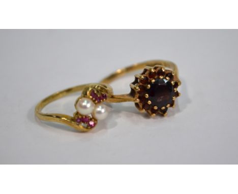 A pearl and ruby crossover ring, 9ct yellow gold, to/w garnet cluster ring, 9ct yellow gold (2)
