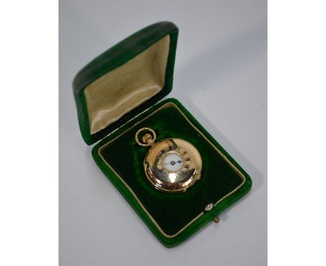An Edwardian lady's 12ct gold half-hunter fob-watch with top-wind lever movement, London Import 1907, in green velvet case Co