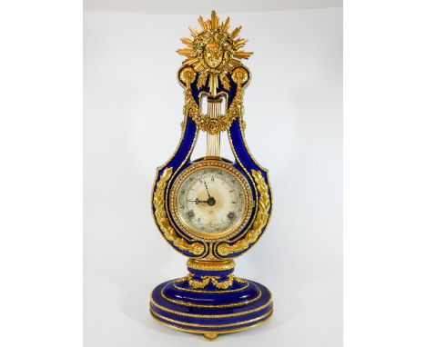 A blue porcelain lyre shaped mantle clock after a copy in The Victoria &amp; Albert Museum the 'Marie Antoinette Clock', heig