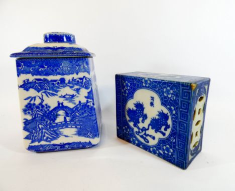 A Chinese blue and white incense pillow and a blue and white willow pattern tea caddy and cover of tapering square form, ince