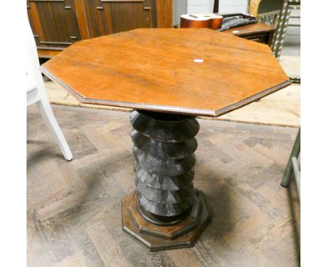 An unusual oak circular occasional table on carved column base 