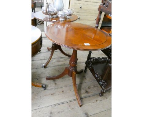 A pair of circular reproduction yew wood occasional tables on tripod bases matching  Lot 340